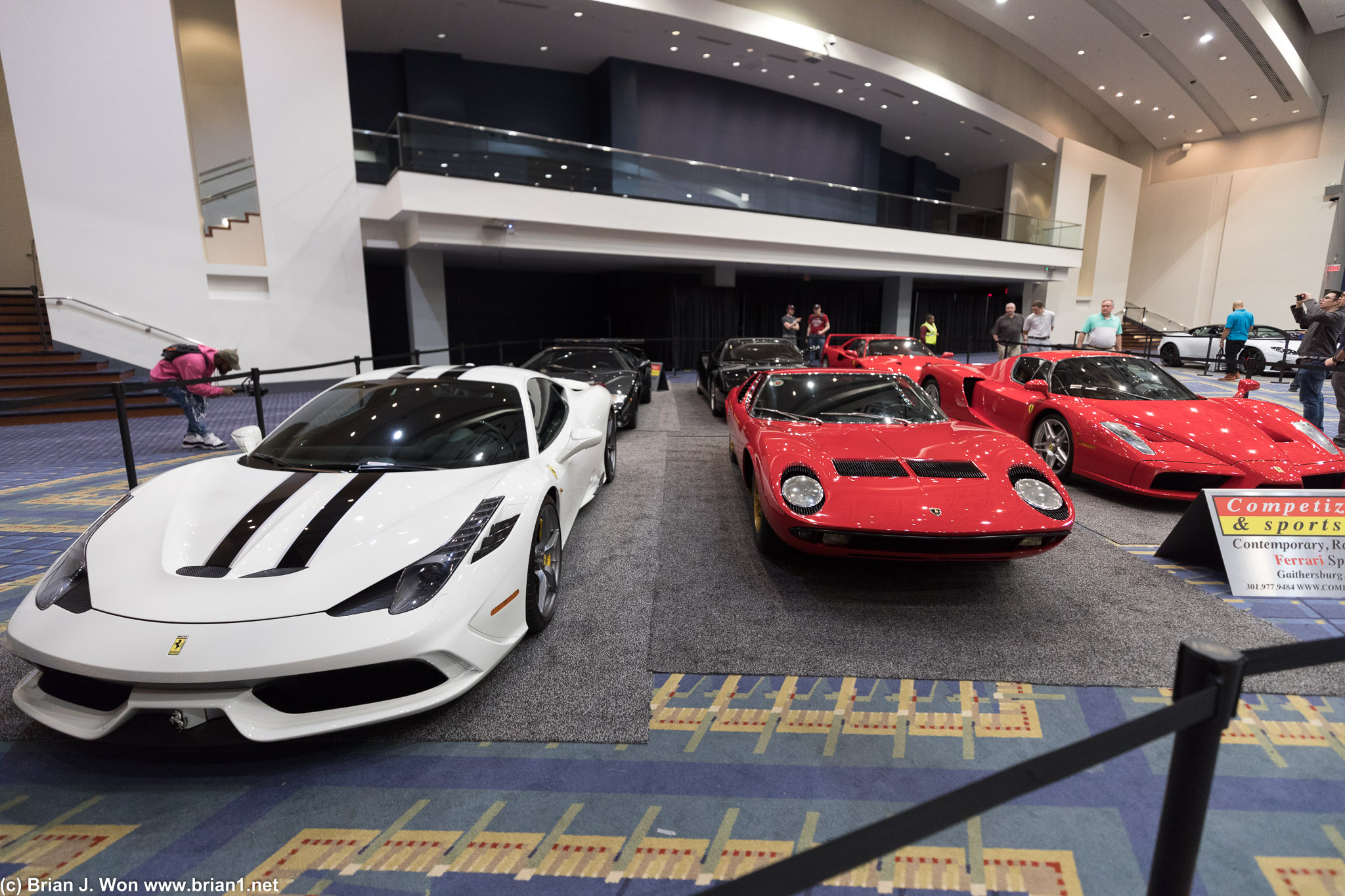 Ferrari 458 Italia on left, Enzo on right, Lamborghini Miura at center.